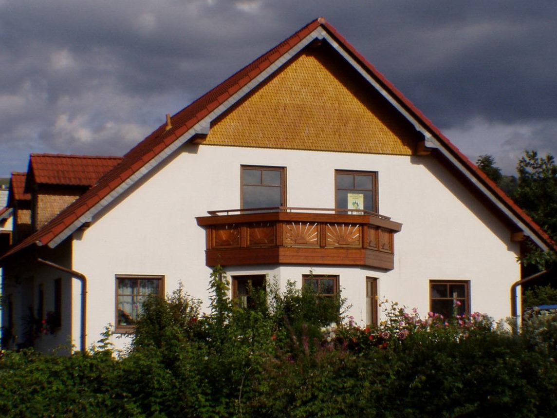 Beispiele Holschindel-Fassaden